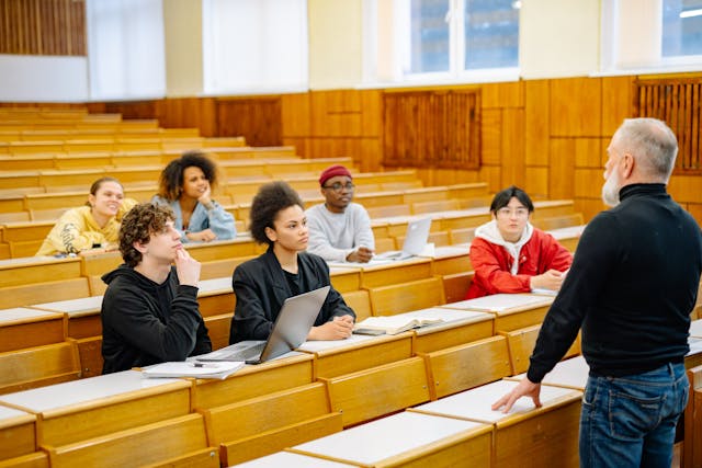 Professor teaching students in university classroom