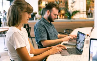 Woman using a laptop to perform marketing tasks