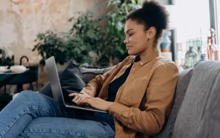 Woman using laptop for distance learning studies