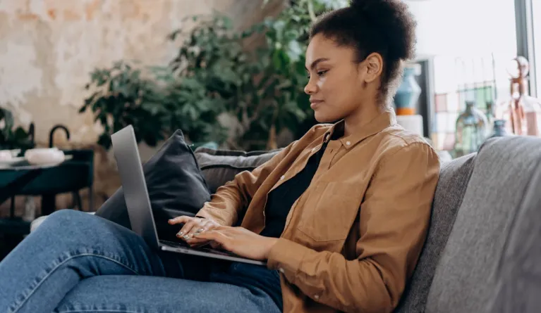 Woman using laptop for distance learning studies